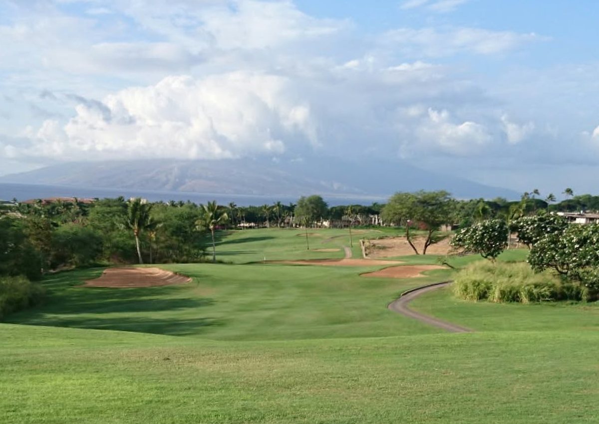 Original phone photo looking down a Maui fairway towards the sea and a distant island